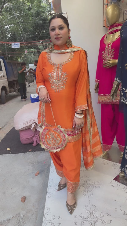 Biwi Rust Orange Embroidered Designer Suit with potli