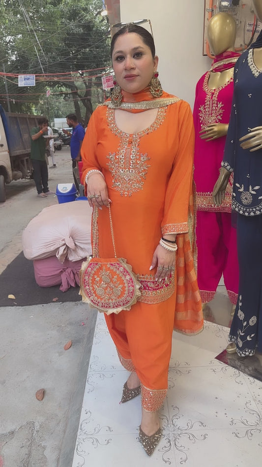 Biwi Rust Orange Embroidered Designer Suit with potli