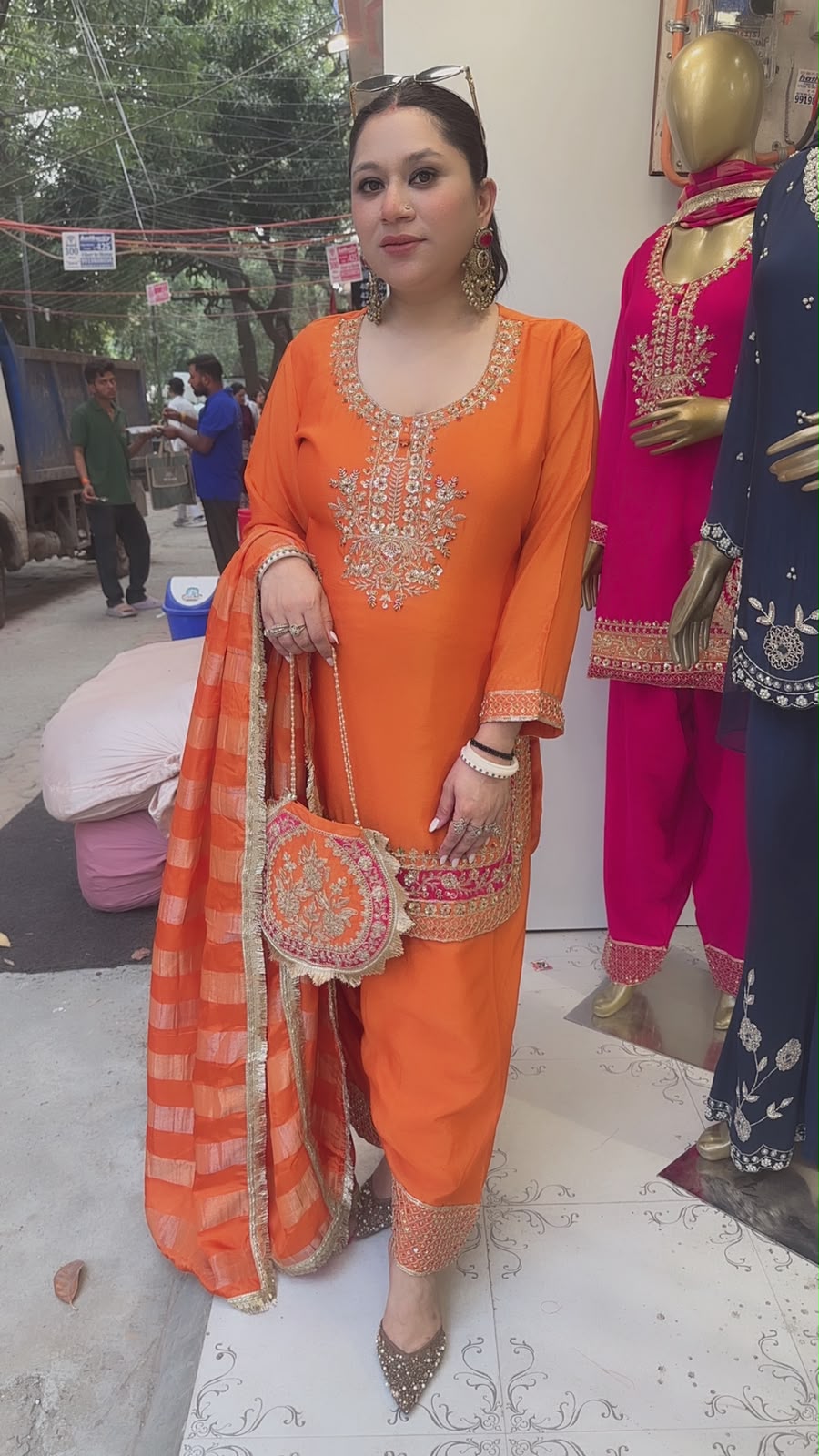 Biwi Rust Orange Embroidered Designer Suit with potli